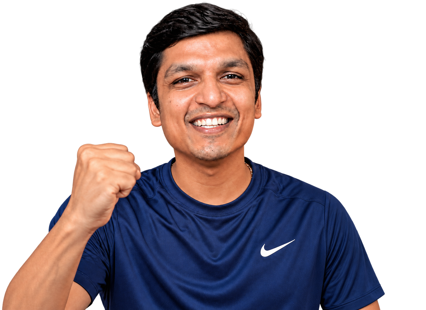 Aravindan smiling in a navy T-shirt with one fist raised